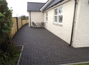 Block paved patio area at side of house